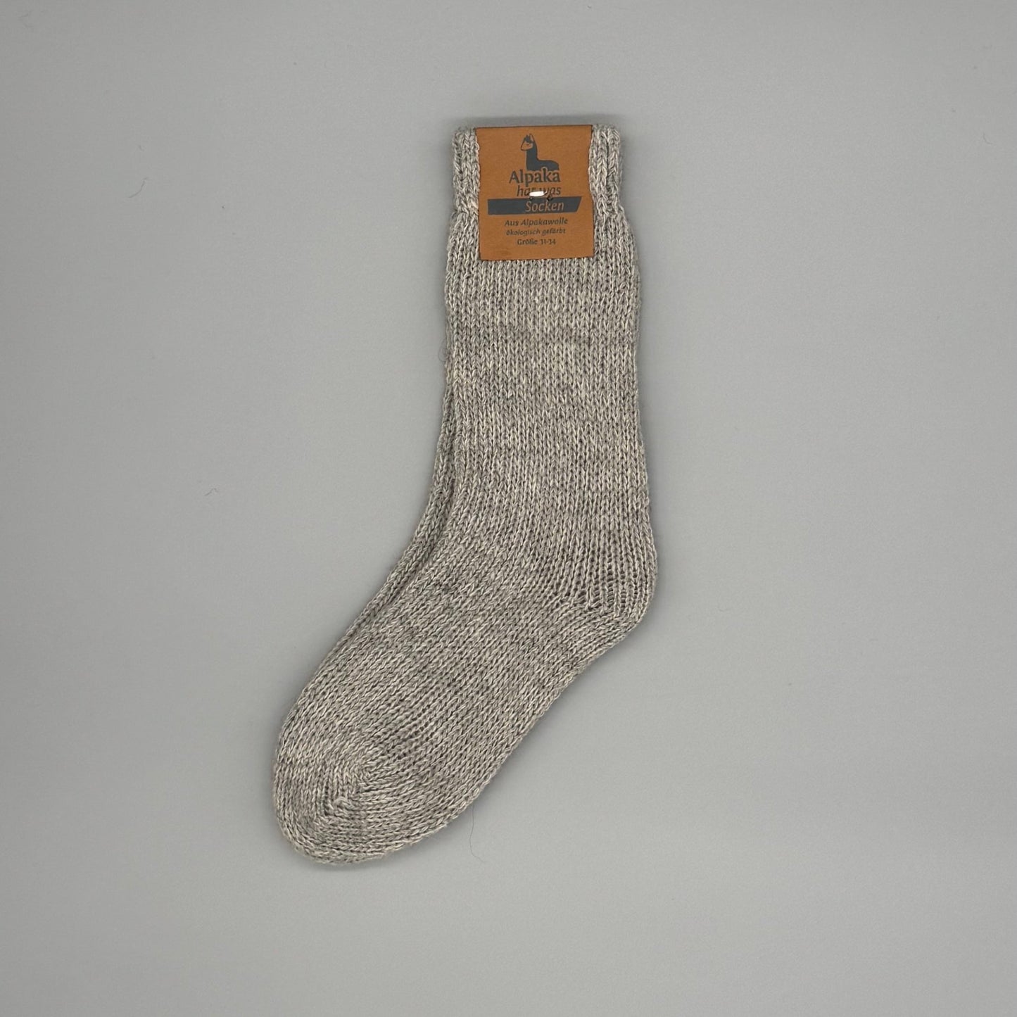 Alpaka Kindersocken aus 92% Alpakawolle in neutralem Farbton, ideal für warme, atmungsaktive Füße.