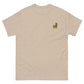 Beige T-Shirt mit gesticktem Alpaka Emoji auf der Brust – perfektes Unisex Shirt für Alpaka-Fans, 100% Baumwolle.